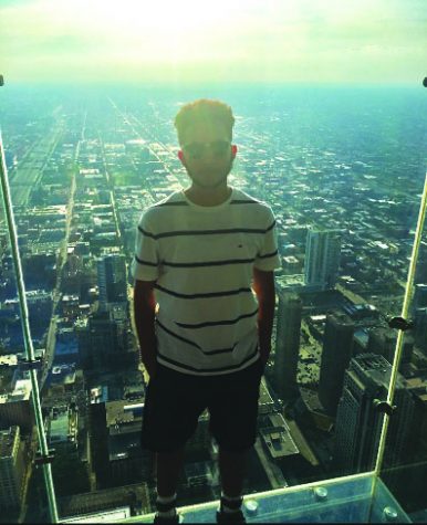 Luis Moreno admiring Chicago at the edge of the Willis Tower.