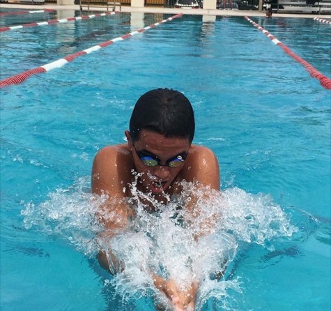 Kevin Hernandez performing the 100 breast stroke.