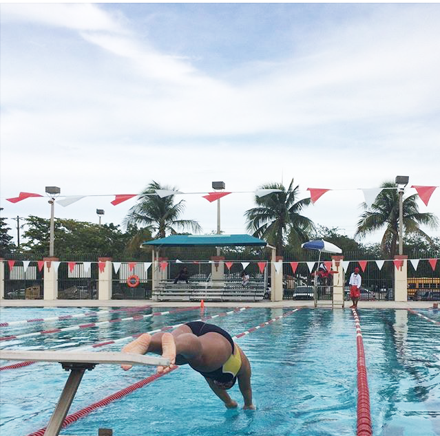 Elizabeth Astacio jumping in the pool against the South Miami Cobras.