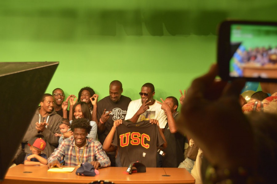 Keyshawn Pie Young celebrating after announcing the school he intends to attend.