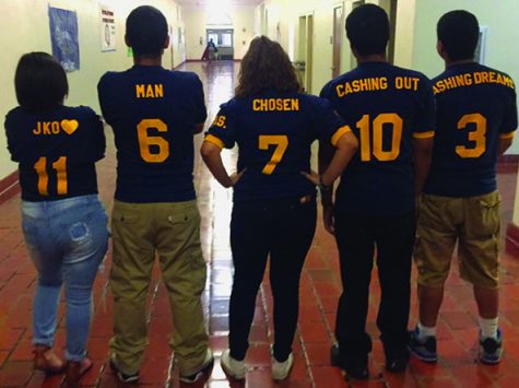 The class officers with their jerseys.