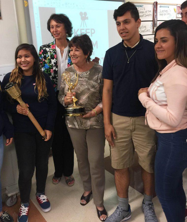 Claire Barrett Young(middle) posing with a few T.V. production students holding her “Sports Emmy Award” for outstanding Individual Achievement.