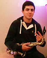 Camilo likes to play the saxophone