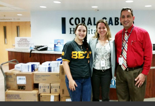 Student Adalain Sans with Coral Gables Hospital Human Resources Chair and Coral Gables Hospital CEO.