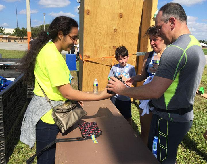 Sophomore and Interact member Alba Santana doing her community service hours at the Inflatable 5K on December 3rd.