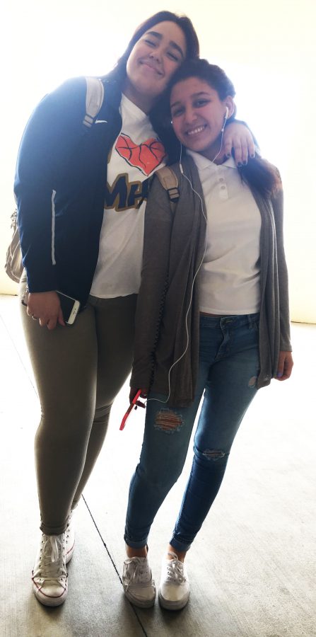 Junior Michelle Gutierrez and senior Ashley Rae with school uniform on.