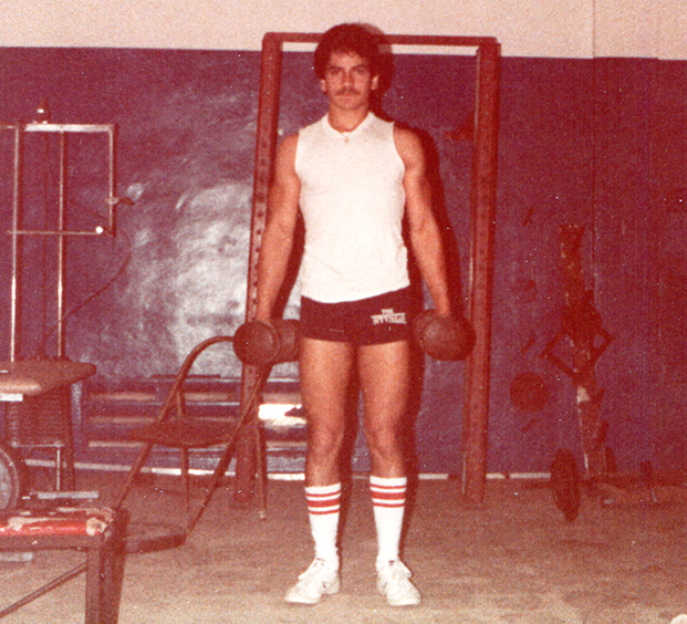 Eddie in old weight room at Miami High.