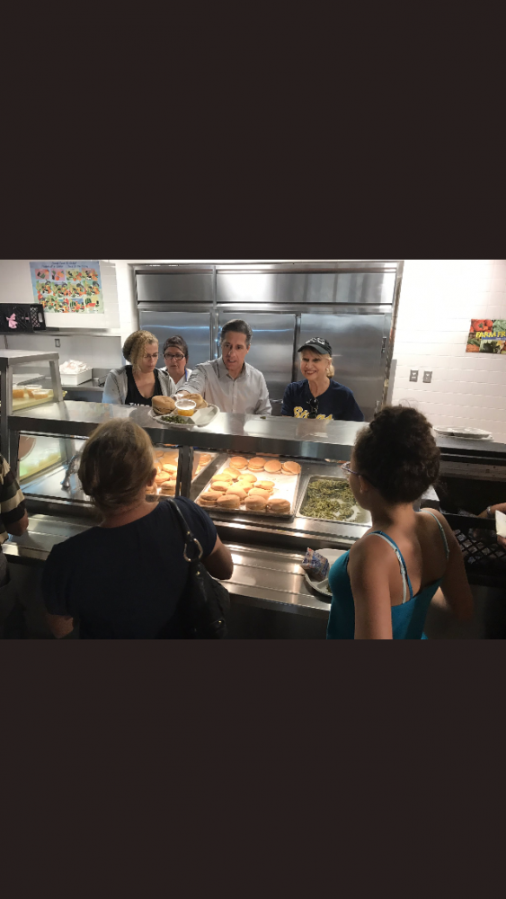 Superintendent Alberto Carvalho and School Board Member Mari Tere Rojas pass out hot food to those impacted by Hurricane Irma on Friday, September 15, 2017.