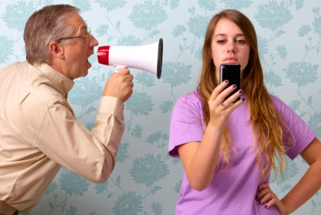 Father shouting at daughter texting