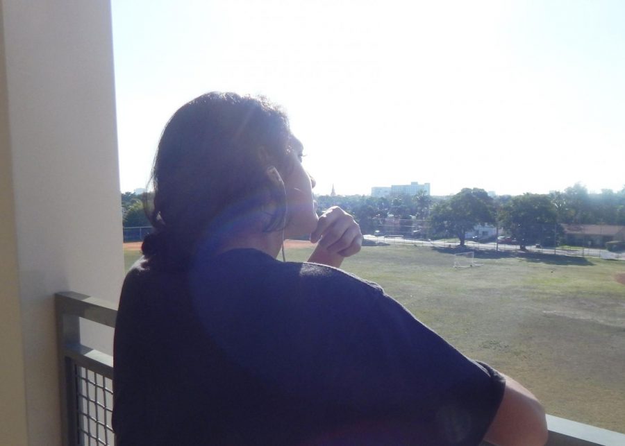 David Gutierrez looks at the sky as he listens to music, unsure of what  he wants to do after finishing high school.