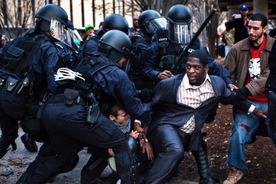 Bishop Derrick Robinson, who became a notable leader among the Ferguson protesters, was arrested by riot police while protesting in a public park (St. Louis, November 30, 2014).
