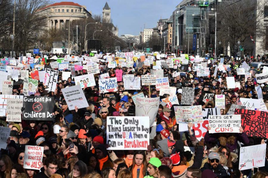 People arrive for the March For Our Lives rally against gun violence in Washington, DC on March 24, 2018.
Galvanized by a massacre at a Florida high school, hundreds of thousands of Americans are expected to take to the streets in cities across the United States on Saturday in the biggest protest for gun control in a generation. / AFP PHOTO / Nicholas Kamm
