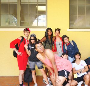 Students pose in front of the cafeteria sporting their Gender Swap Day costumes.