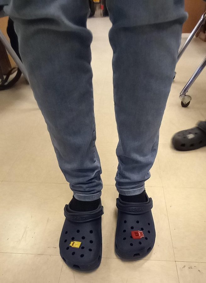 Freshman wears crocs with designed charms, inspired by  former player Kobe Bryant. 