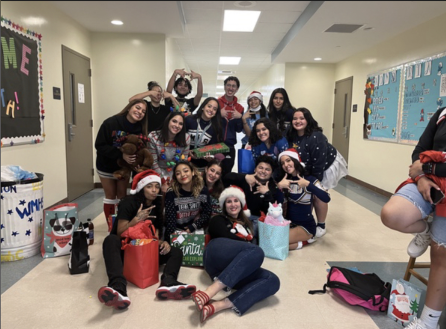Honoria students and Ms.Aragon during a Secret Santa celebration