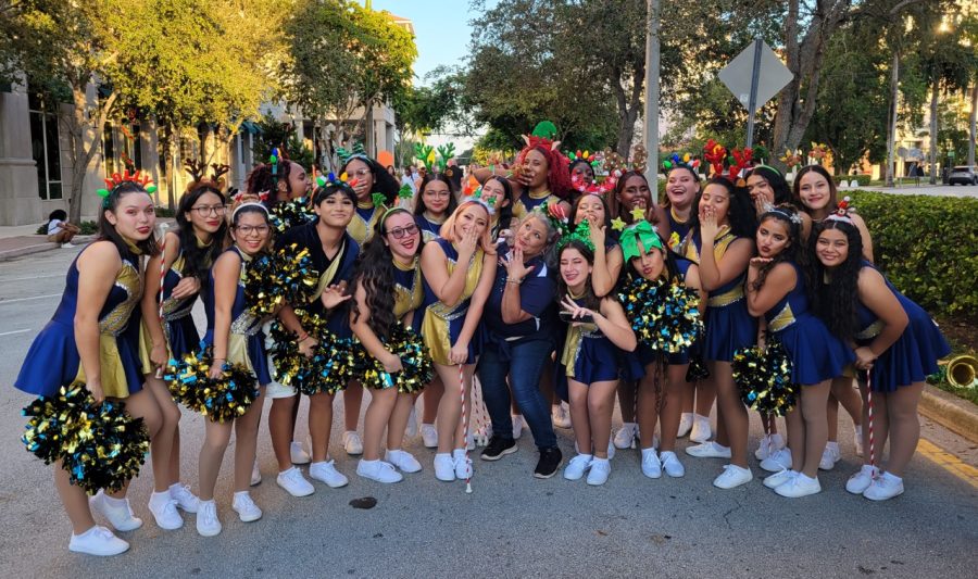 Ms. Armas (center) with the color guard on Miracle Mile for the Christmas parade