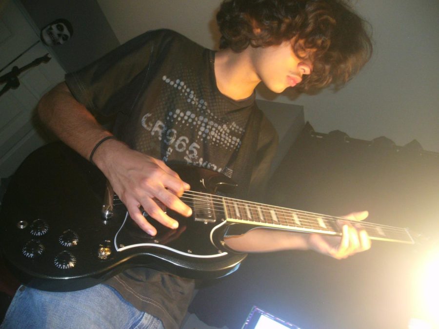 Diego Playing the Electric Guitar
(photograph by Natalie Morales)