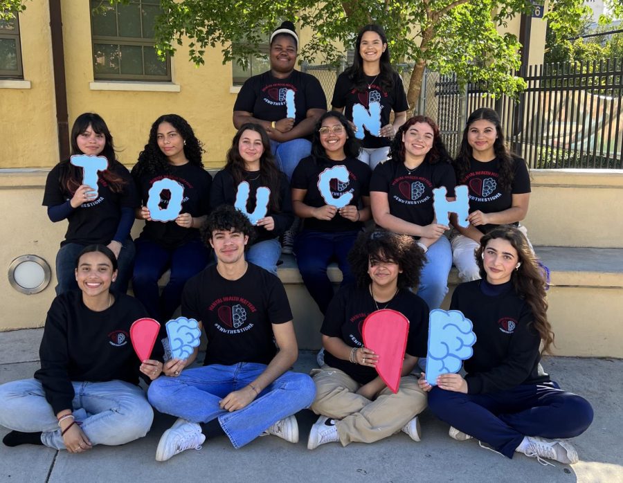 President Salana Hill holding the I, 2nd VP Yasmine C. in the second row holding the T, 1st VP Nicole R. holding the O corresponding secretary Brooke M. (third in front row) and treasurer Nelissa H. (last in front row