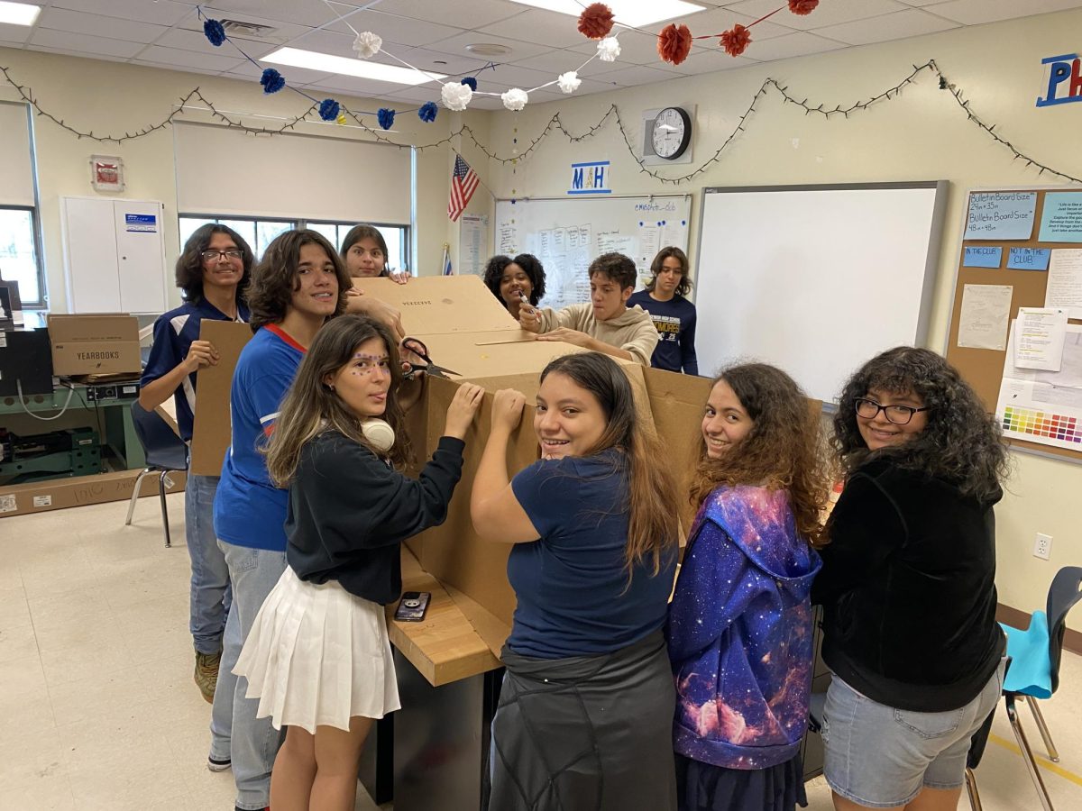 Photography Club Members Working on their Homecoming Prop. 