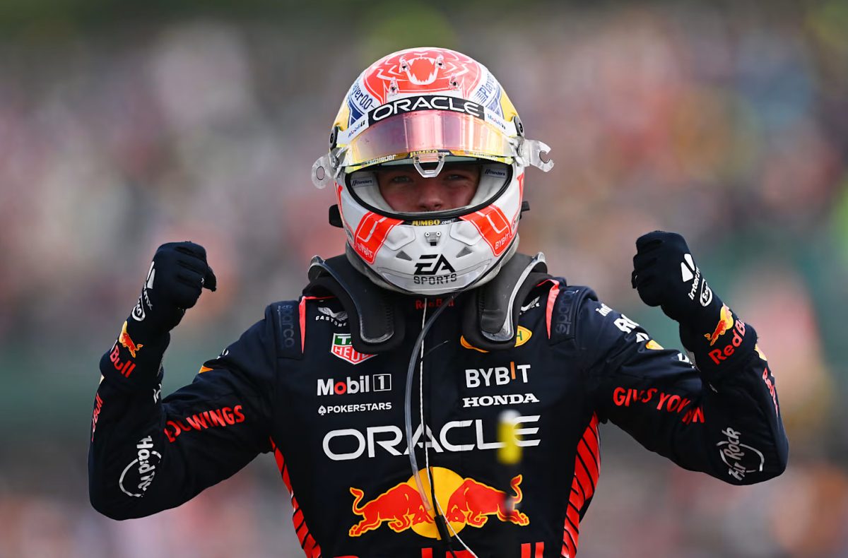 Max Verstappen celebrating his 10th win in a row, a new record for most wins in a row.