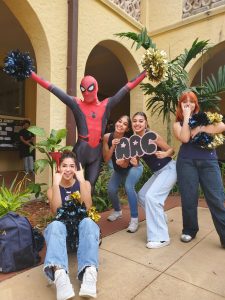 AACs Spiderman with the MHS Cheerleaders at the club fair.