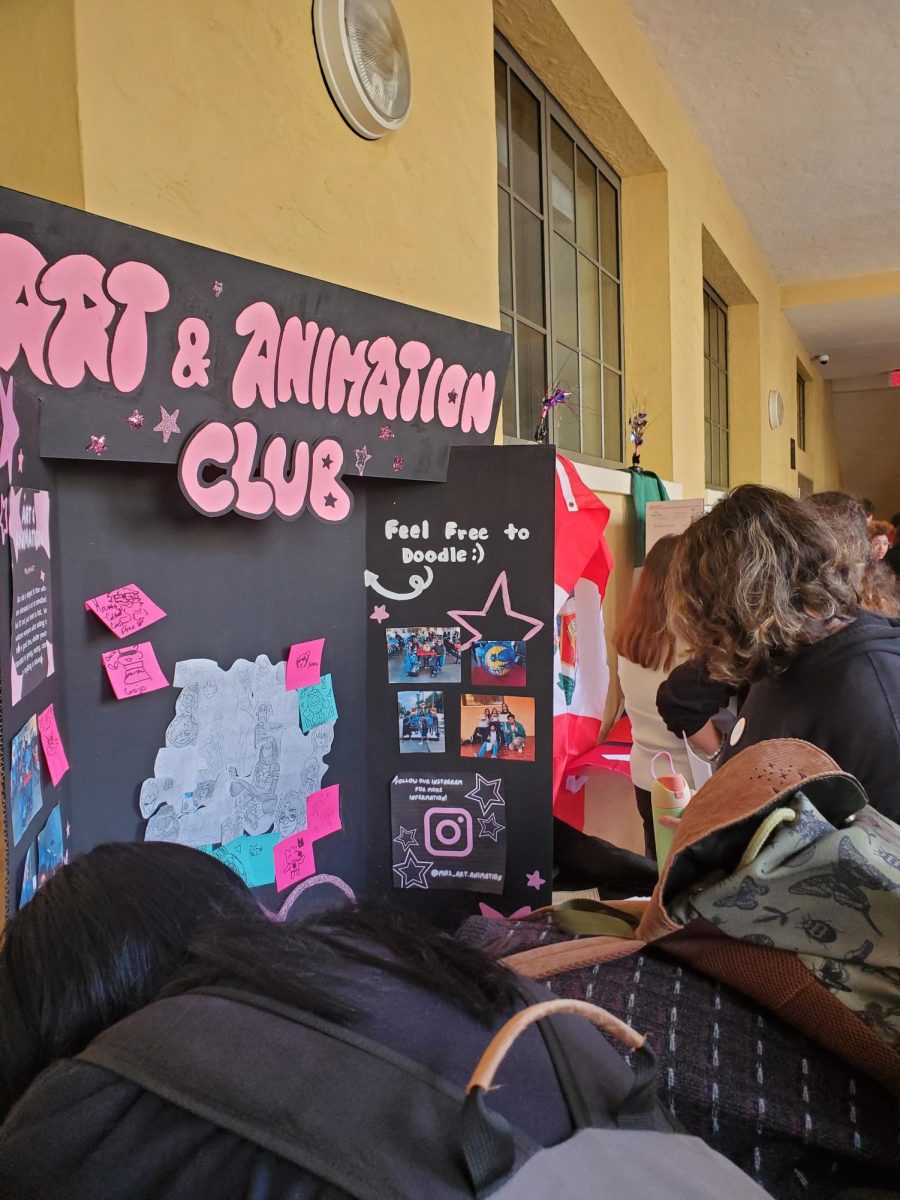 The Art & Animation Club letting people draw on their board at the club fair.
