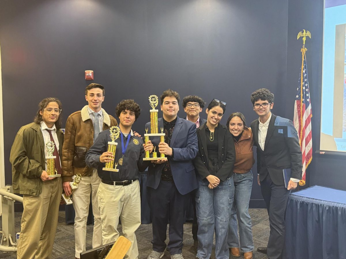 From left to right: Danny Davila, Alessandro De Palma, Micheal Porras, Miguel Zapata, Andres Hernandez, Lauriet Campos, Ms. Perez, and Denis Incer.