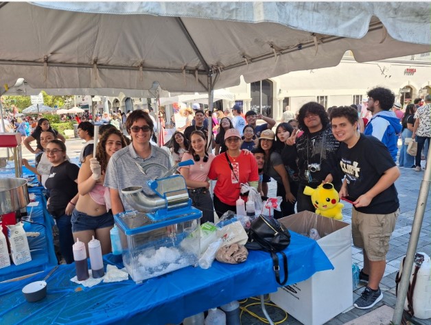 Key Club members giving out cones of ice-cream on the carnival