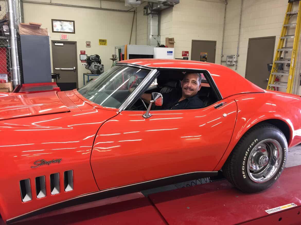 Chess teacher Mr. Bello is also an automotive teacher.