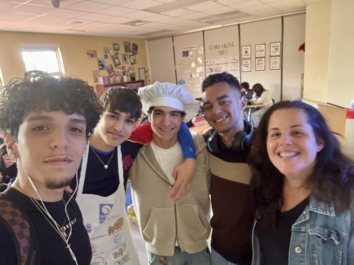 Abraham Martinez, Dixon Gonzales, Mauricio Páez and Ernesto Carbonell next to Ms. Diaz.