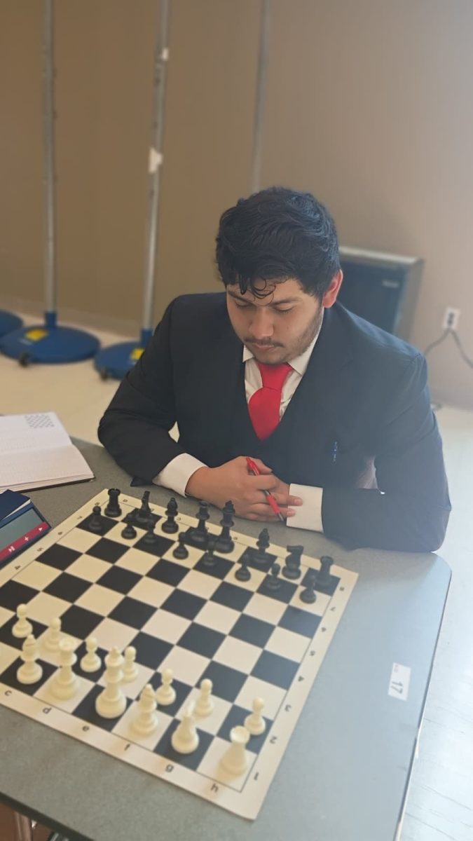 Kevin Flores playing chess in Hialeah Gardens for the scholastic league
