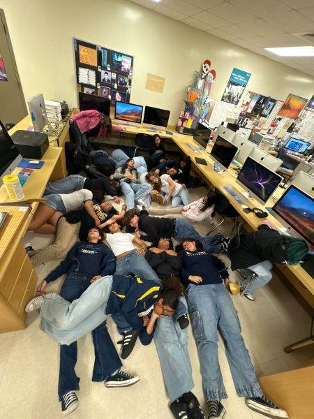 Miahi playing dead to advertise the yearbook on the Miahi Instagram page.